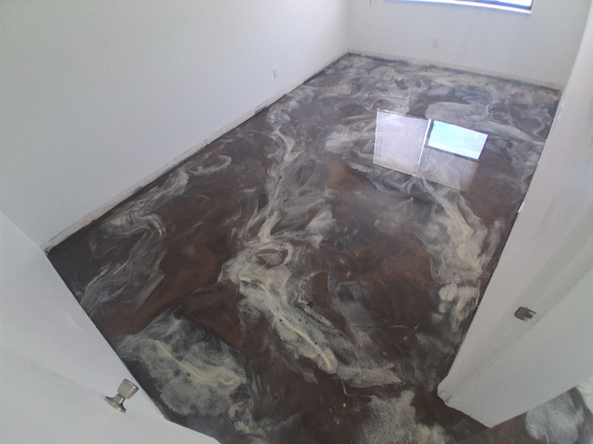 Brown and pearl metallic epoxy floor in a Cocoa Beach condo home office