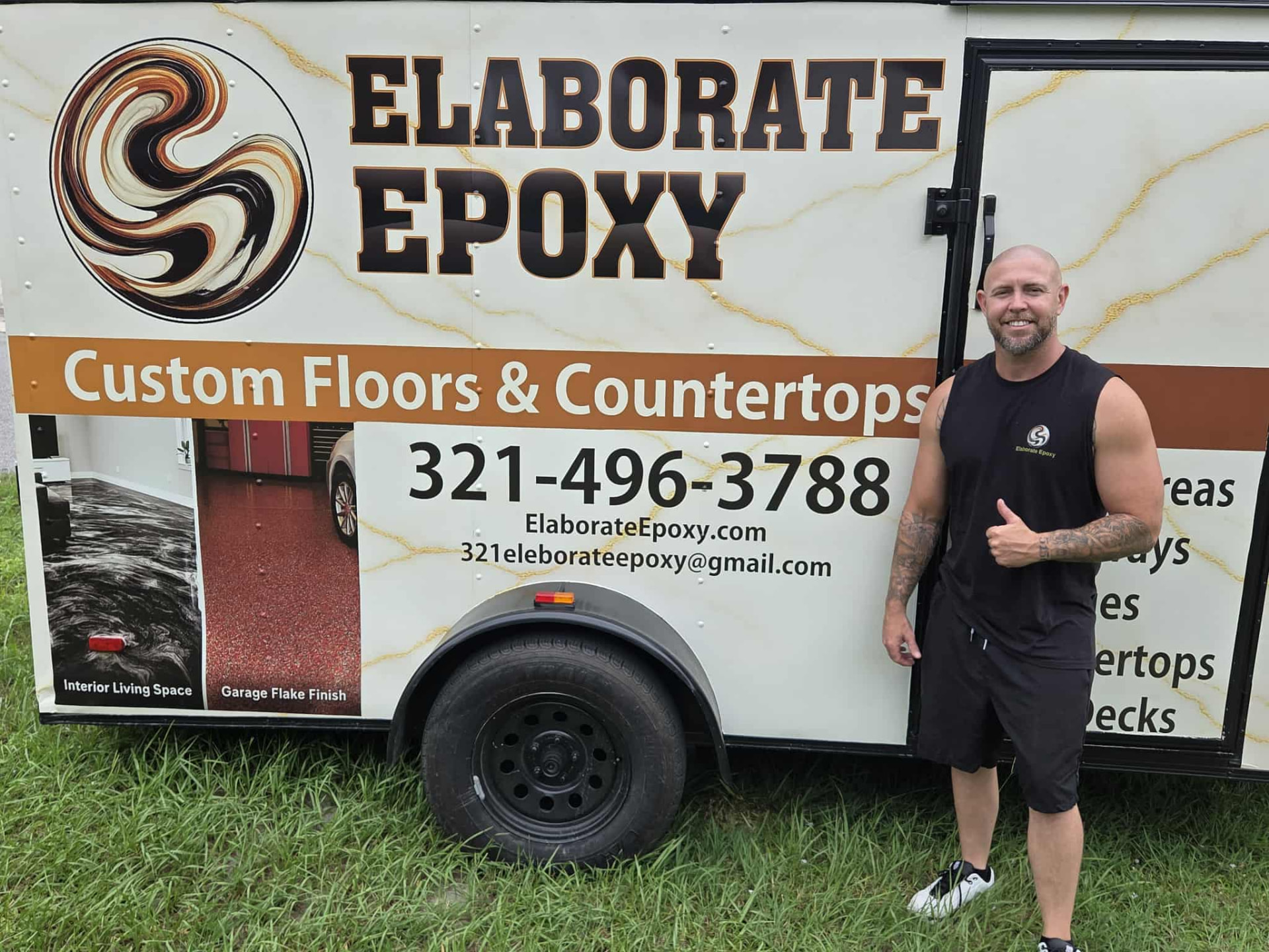 Elaborate Epoxy owner standing beside the company trailer