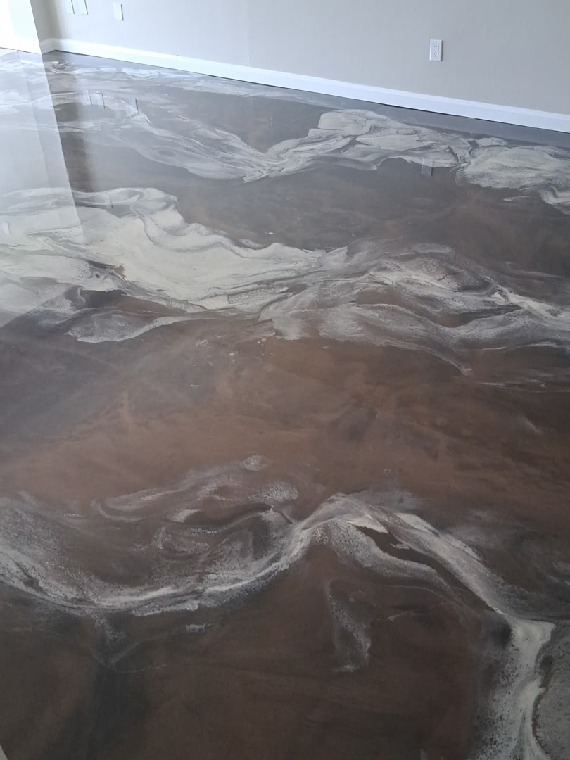 Close-up detail of brown and pearl marble-style metallic epoxy floor movement